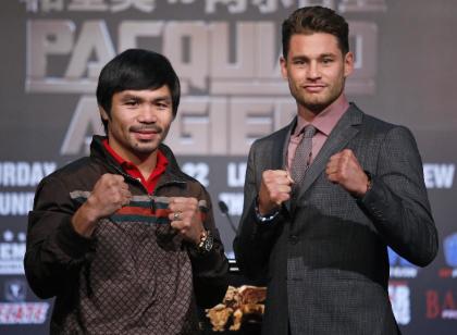 Manny Pacquiao, left, and Chris Algieri pose for photographers during a news conference in Macau. (AP)