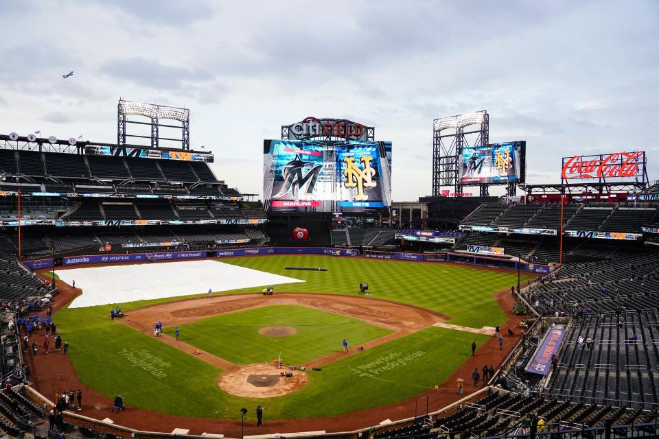 The grounds crew works on the field before a baseball game between the Miami Marlins and the New York Mets, Tuesday, Sept. 26, 2023, at Citi Field in New York. (AP Photo/Frank Franklin II)