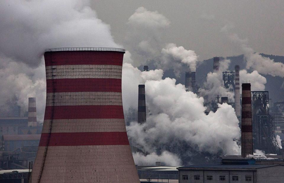 Smoke billows from smokestacks and a coal fired generator at a steel factory on November 19, 2015 in the industrial province of Hebei, China (Getty Images)