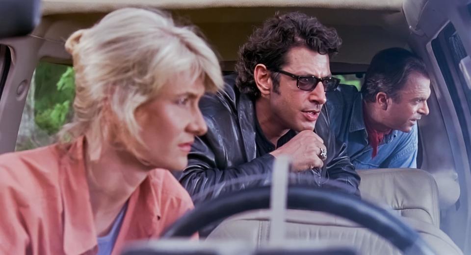 USA. Laura Dern , Sam Neill and Jeff Goldblum in a scene from (C)Universal Pictures   film: Jurassic Park (1993).  Plot: A pragmatic paleontologist visiting an almost complete theme park is tasked with protecting a couple of kids after a power failure causes the park's cloned dinosaurs to run loose.  Director: Steven Spielberg  Ref: LMK110-J7096-110521 Supplied by LMKMEDIA. Editorial Only. Landmark Media is not the copyright owner of these Film or TV stills but provides a service only for recognised Media outlets. pictures@lmkmedia.com