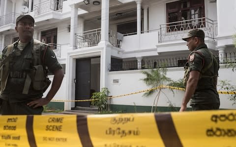 Police outside the home of Mohammed Yusuf Ibrahim, a wealthy spice trader and pillar of the Sri Lankan business community - Credit: &nbsp;Sam Tarling