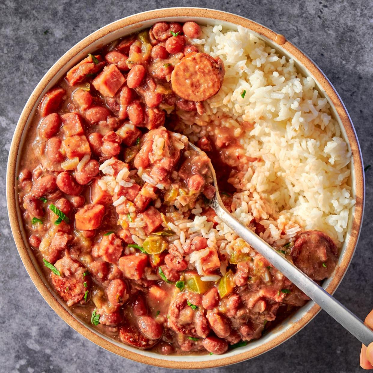 a creole classic with tender, creamy red beans stewed in smoked ham and andouille sausage and flavored with holy trinity vegetables, then served over steamed rice