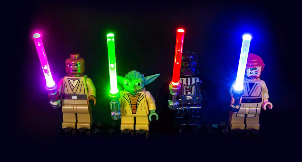 Four LEGO Star Wars mini-figures with LED Lights in their lightsabers