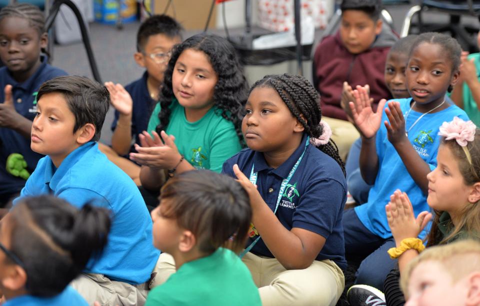 Third-grade students at Tuttle Elementary applaud at the conclusion of a book reading on Tuesday. Embracing Our Differences arranged for more than 100 volunteers to read aloud to more than 9,000 students in Sarasota and Manatee County schools on Tuesday, March 7, 2023. Each participating student also received a free new book.