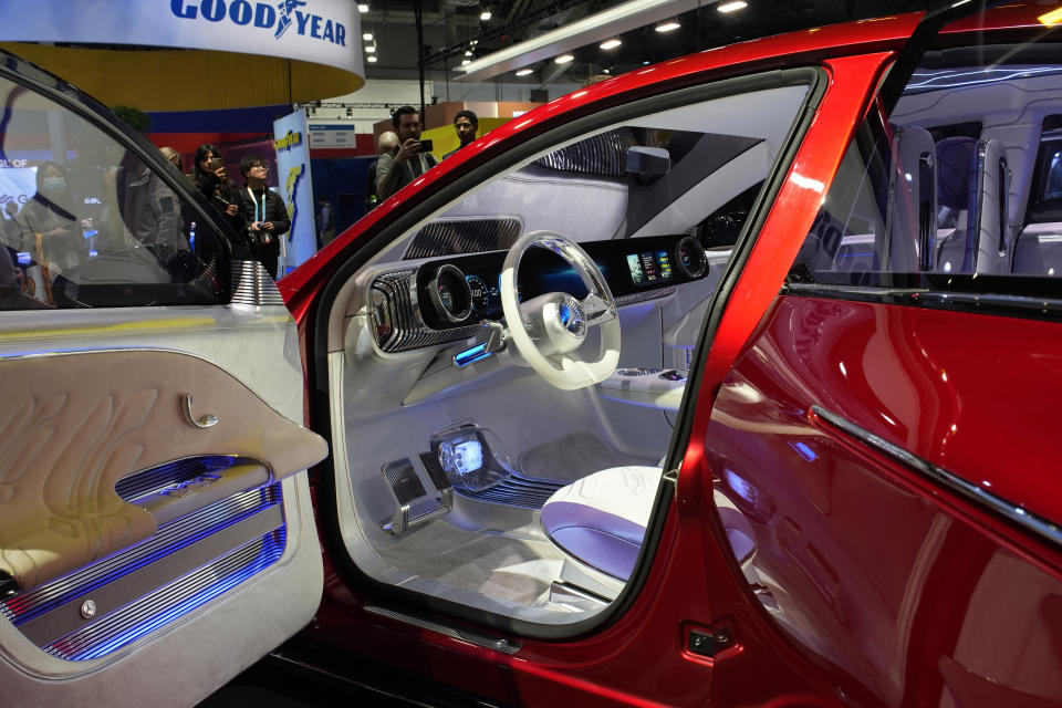 FILE - A Mercedes-Benz Concept CLA Class car is displayed at the Mercedes-Benz booth during the CES tech show, Wednesday, Jan. 10, 2024, in Las Vegas. Mercedes-Benz, for its part, debuted its next-generation AI virtual assistant software. The upcoming version of Mercedes’ MBUX infotainment interface, dubbed MB.OS. A version of MB.OS is set to debut in Mercedes’ upcoming electric-powered CLA sedan.(AP Photo/John Locher, File)