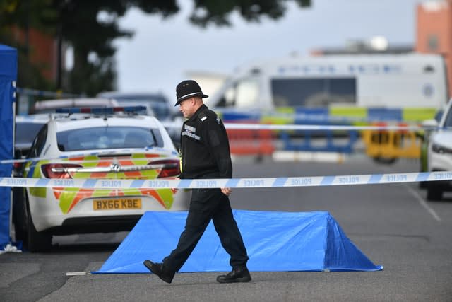 A police officer at a cordon in Irving Street 