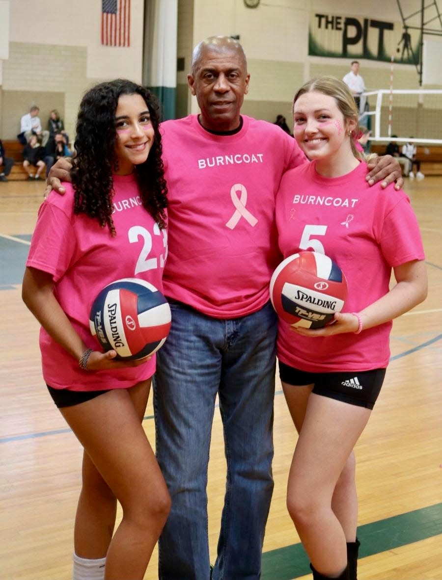 Burncoat volleyball captains Jada Haney, left, and Kaylee Kalagher, right, pose with coach Phil Malette.