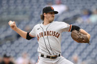 San Francisco Giants starting pitcher Kevin Gausman delivers a pitch during the first inning of the first baseball game of a doubleheader against the Washington Nationals, Saturday, June 12, 2021, in Washington. This game is a makeup of a postponed game from Thursday. (AP Photo/Nick Wass)