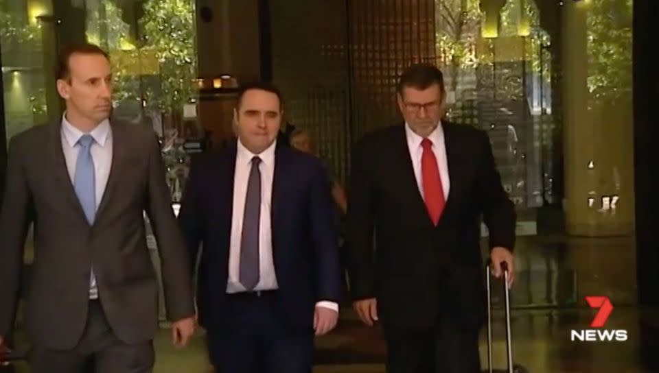 McCormack, centre, with his lawyer Sam Macedone, right. Source: 7 News