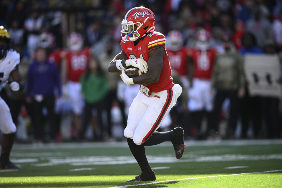 Maryland running back Roman Hemby (24) runs with the ball during the first half of an NCAA college football game against Michigan, Saturday, Nov. 18, 2023, in College Park, Md. (AP Photo/Nick Wass)