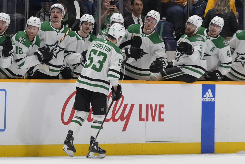 Dallas Stars center Wyatt Johnston (53) celebrates a goal with teammates during the first period of an NHL hockey game against the Nashville Predators, Thursday, Feb. 15, 2024, in Nashville, Tenn. (AP Photo/George Walker IV)