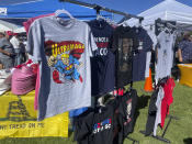 Merchandise with an "Ultramaga" theme is sold at the seventh annual Basque Fry at the Corley Ranch on Saturday, Aug. 13, 2022, outside Gardnerville, Nev. The event, which includes live music, an inflatable rodeo ride and Basque cuisine, is modeled after Republican Nevada Senate candidate Adam Laxalt's grandfather and former Nevada governor Paul Laxalt's cookouts. The elder Laxalt was the son of Basque immigrants, and Adam now hosts the event with the Morning in Nevada PAC. (AP Photo/Gabe Stern)