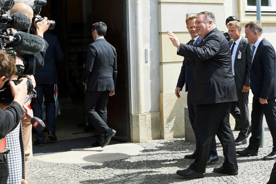 Danish Foreign Minister Jeppe Kofod, greets US Secretary of State Mike Pompeo foreground right, upon his arrival to the Ministry of Foreign Affairs, Eigtveds Pakhus, in Copenhagen, Denmark, Wednesday, July 22, 2020. Pompeo arrived in Denmark on Wednesday for meetings with the country's leaders that are likely to address the construction of a disputed gas pipeline which Washington opposes. (Thibault Savary/Pool Photo via AP)