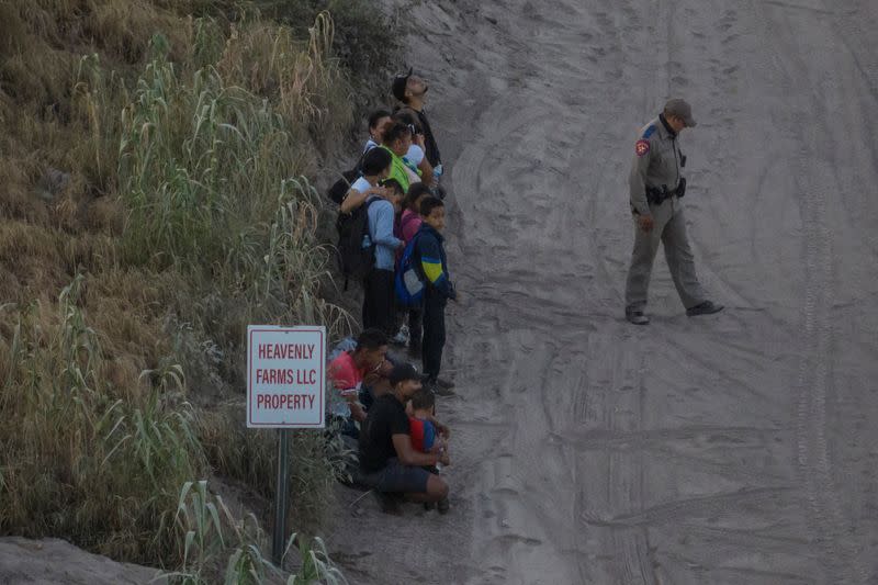 Migrants surrender after crossing into Eagle Pass, Texas