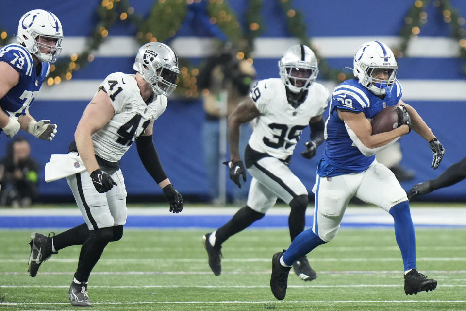 Indianapolis Colts running back Jonathan Taylor, right, runs during the second half of an NFL football game against the Las Vegas Raiders, Sunday, Dec. 31, 2023, in Indianapolis. (AP Photo/AJ Mast)