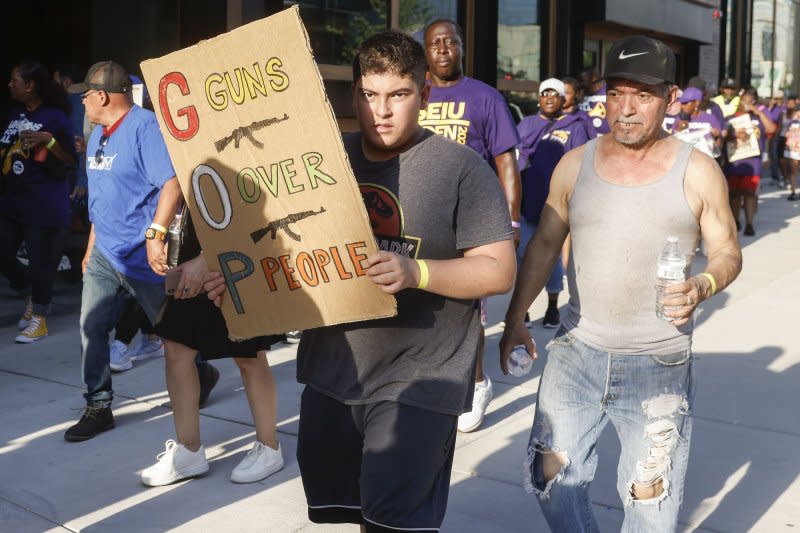 Union supporters march and protest at the first Republican presidential candidate debate at Fiserv Forum in Milwaukee, Wisc., on Wednesday. Photo by Tannen Maury/UPI