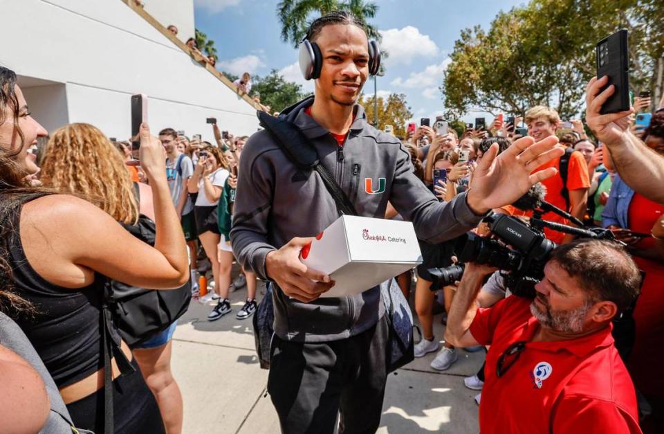 Miami Hurricanes men’s basketball player Isaiah Wong is greeted by fans outside the University of Miami’s Watsco Center as the team prepares to depart on Wednesday, March 29, 2023, for the NCAA Final Four games in Houston.