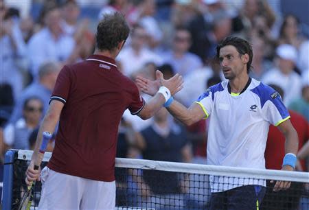 Richard Gasquet of France (L) is congratulated by David Ferrer of Spain after their match at the U.S. Open tennis championships in New York September 4, 2013. REUTERS/Eduardo Munoz