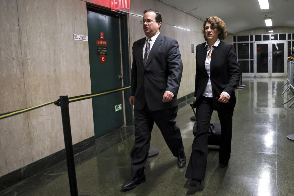 Prosecutor Susan Hoffinger, right, leaves the courtroom during jury deliberation in the Trump Organization's tax fraud case, Tuesday, Dec. 6, 2022, in New York. (AP Photo/Julia Nikhinson)