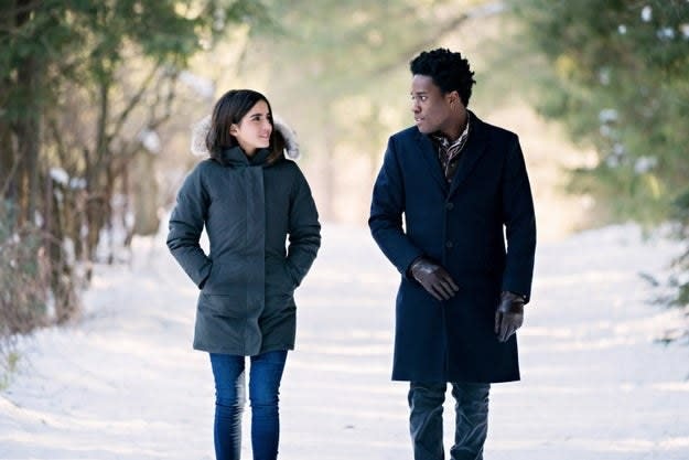 A woman and man walking in the snow