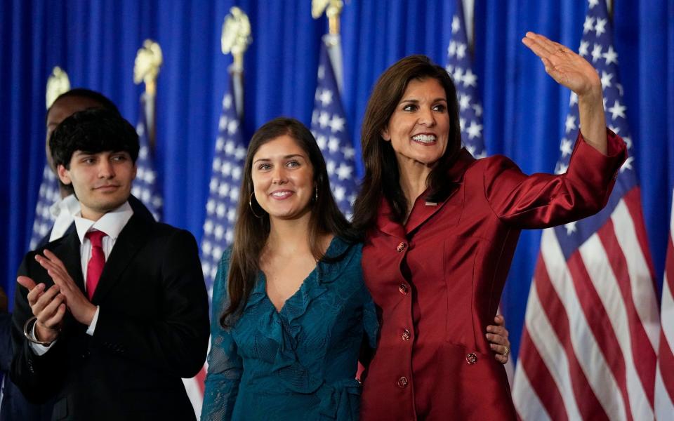 Nikki Haley, right, is joined on stage with her son, Nalin, and daughter, Rena, during the Republican primary in South Carolina