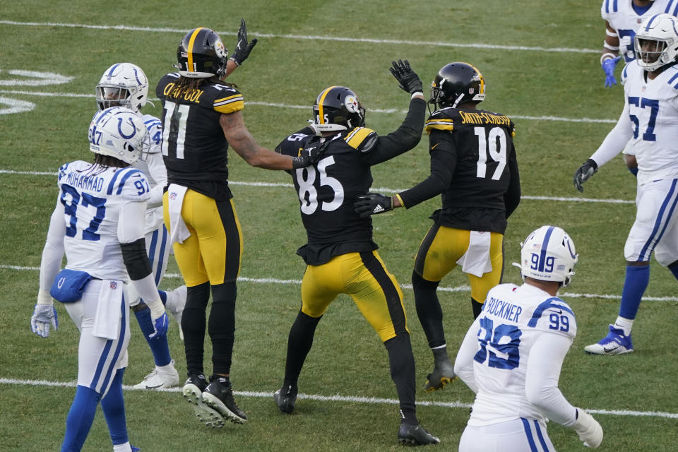 Pittsburgh Steelers tight end Eric Ebron (85) celebrates with wide receivers Chase Claypool (11) and JuJu Smith-Schuster (19) after making a touchdown catch against the Indianapolis Colts during the second half of an NFL football game, Sunday, Dec. 27, 2020, in Pittsburgh. (AP Photo/Gene J. Puskar)