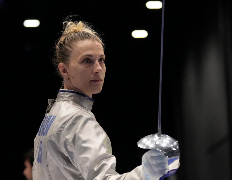 Olga Kharlan, of Ukraine, stands during the women’s team sabre event against Uzbekistan at the Fencing World Championships in Milan, Italy, 29 July 2023 (AP)