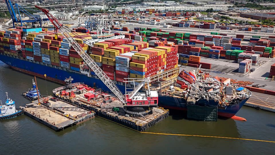 Salvage crews remove pieces of the Francis Scott Key Bridge on the Dali cargo ship on June 18. - Jerry Jackson/Baltimore Sun/TNS/Getty Images