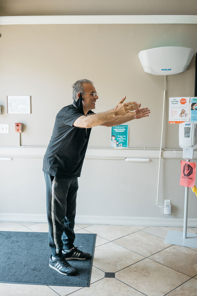 Armen Oaanesyan rejoices as he sees his father Landzhuni Oaanesyan, 81, at the nursing facility. | Isadora Kosofsky for TIME