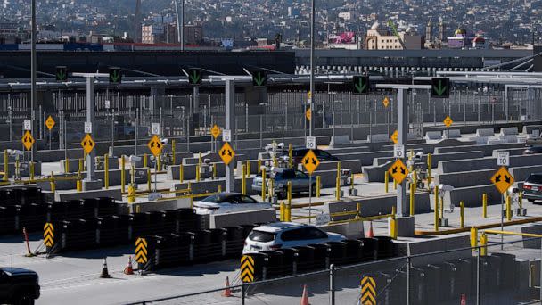 PHOTO: Vehicles enter the San Ysidro Port of Entry border checkpoint at the U.S. - Mexico border, Feb. 19, 2021, in San Diego, Calif. (Patrick T. Fallon/AFP via Getty Images)