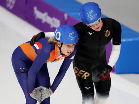 Speed Skating - Pyeongchang 2018 Winter Olympics - Women's Mass Start semifinal - Gangneung Oval - Gangneung, South Korea - February 24, 2018 - Annouk van der Weijden of the Netherlands and Claudia Pechstein of Germany react after the second semi final. REUTERS/Lucy Nicholson