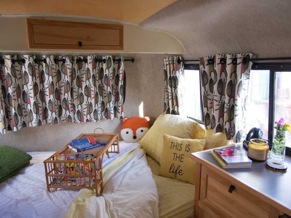 A sleeping area inside a travel trailer