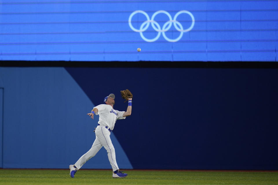 Israel's Mitchell Glasser catches a fly out hit by United States' Jamie Westbrook in the fifth inning of a baseball game at the 2020 Summer Olympics, Friday, July 30, 2021, in Yokohama, Japan. (AP Photo/Sue Ogrocki)