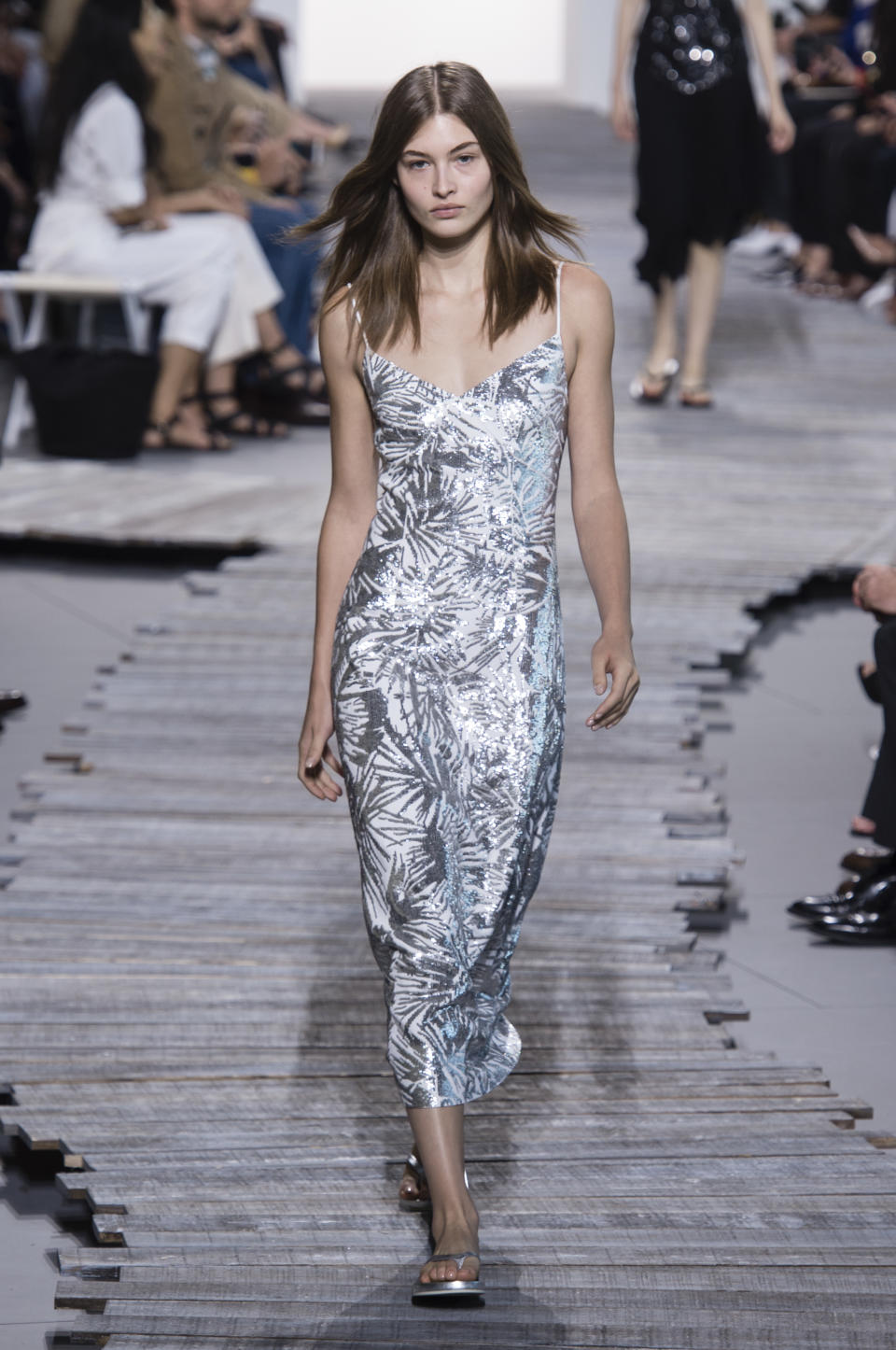 <p><i>Model wears a metallic palm tree print dress from the SS18 Michael Kors collection. (Photo: ImaxTree) </i></p>