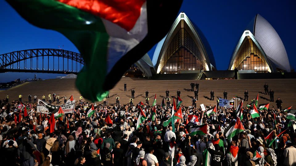 Supporters of the Palestinian cause rally outside the Sydney Opera House on October 9. The famous building was recently illuminated with the flag of Israel. - Dean Lewins/AAP Image/Reuters