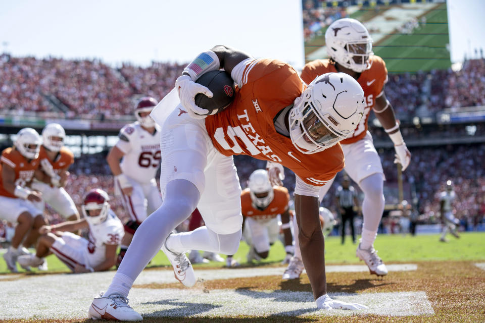 Texas defensive back Malik Muhammad (5) recovers a blocked punt in the end zone for a touchdown during the first half of an NCAA college football game against Oklahoma at the Cotton Bowl, Saturday, Oct. 7, 2023, in Dallas. (AP Photo/Jeffrey McWhorter)