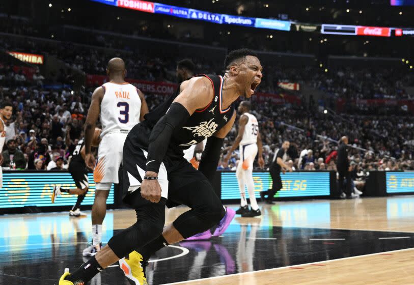LOS ANGELES, CA -APRIL 22, 2023: LA Clippers guard Russell Westbrook (0) reacts after a breakaway slam dunk.