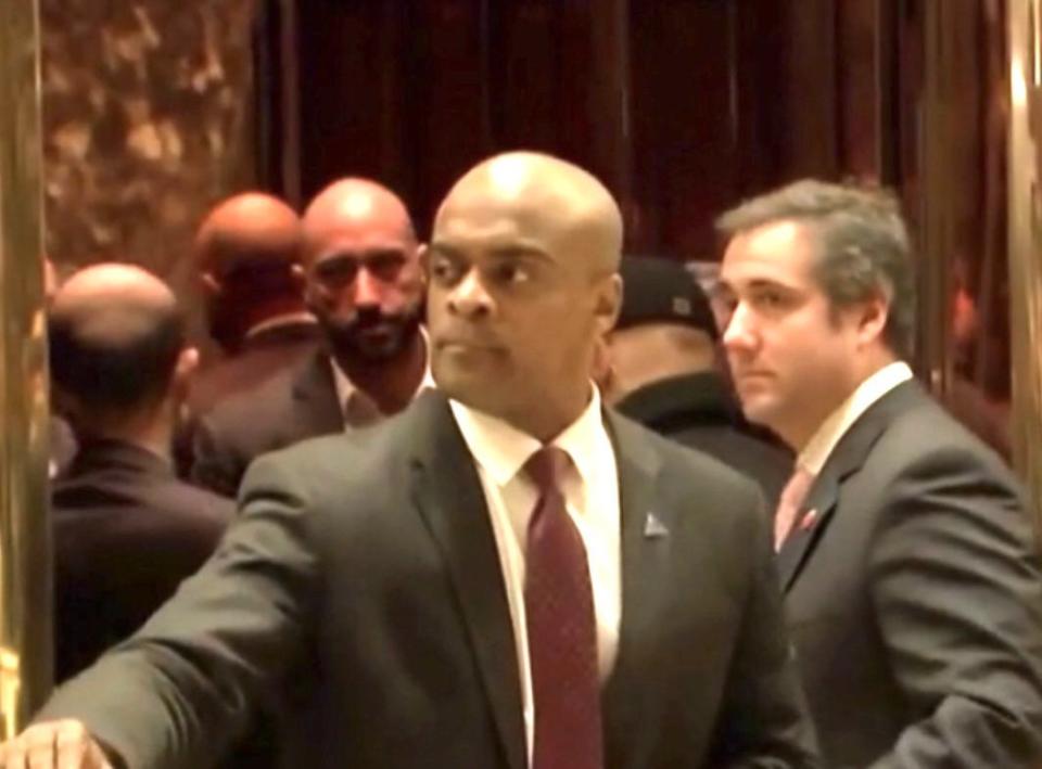 A photo&nbsp;apparently taken from a C-Span video appears to show Michael Cohen&nbsp;(right) about to enter a Trump Tower elevator with a man who looks like Qatari Ahmed al-Rumaihi&nbsp;(left), looking over the shoulder of the lobby guard. (Photo: C-Span screengrab/Michael Avenatti tweet)
