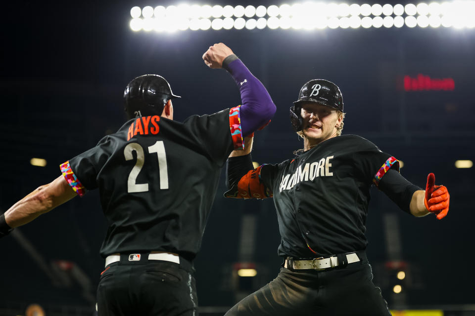 BALTIMORE, MD - AUGUST 25: Gunnar Henderson #2 of the Baltimore Orioles celebrates with Austin Hays #21 after hitting a two-run home run to take the lead against the Colorado Rockies during the eighth inning at Oriole Park at Camden Yards on August 25, 2023 in Baltimore, Maryland. (Photo by Scott Taetsch/Getty Images)