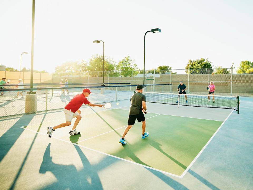 People playing pickleball outside