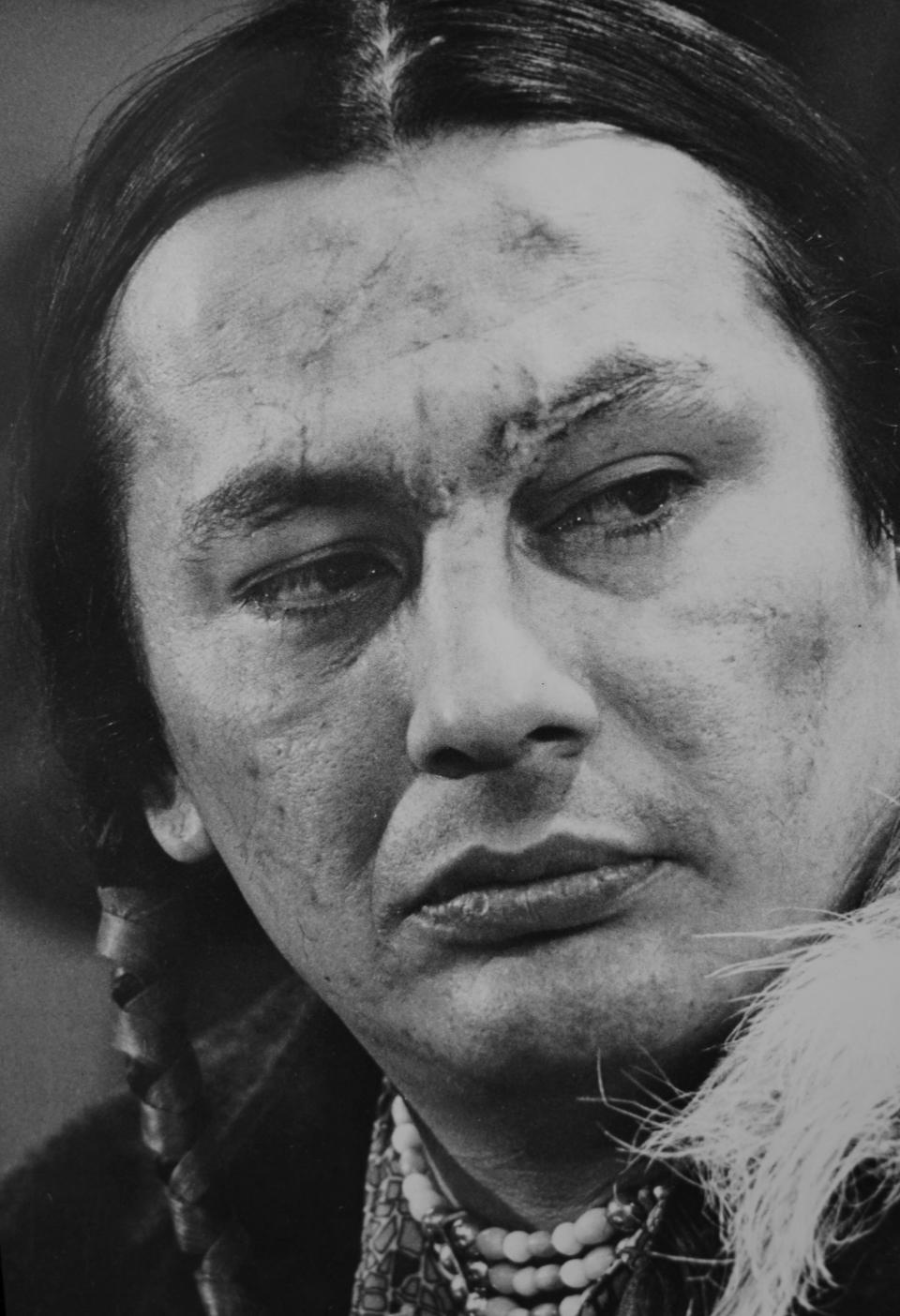 FILE - Russell Means is pictured in Wounded Knee, S.D., in February 1973. Means, an American Indian Movement leader, said they were well armed. “We have high-powered rifles, shotguns, explosives and 14 hand grenades." (AP Photo/Jim Mone, File)