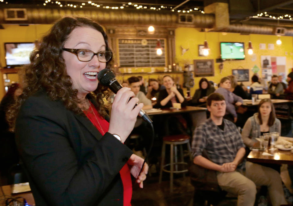 Kara Eastman, the Democrat challenging Bacon for his congressional seat, campaigns in Omaha, Neb. (AP Photo/Nati Harnik)