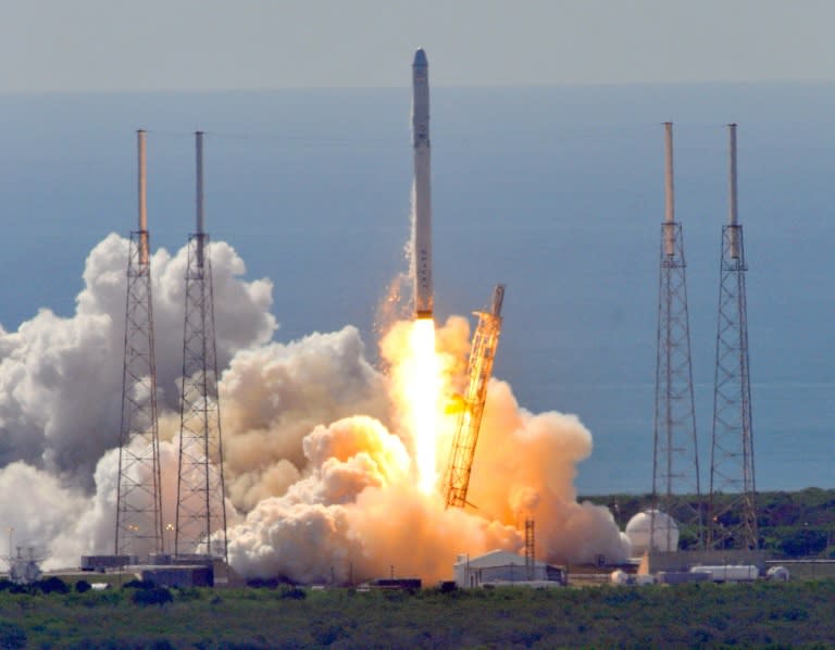 Space X's Falcon 9 rocket as it lifts off from space launch complex 40 at Cape Canaveral, Florida on June 28, 2015 with a Dragon CRS7 spacecraft