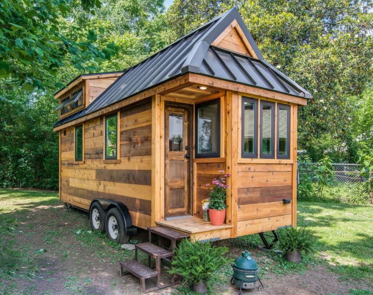 <p>The Cedar Mountain Tiny House, built by Nashville-based <a class="link " href="http://www.newfrontiertinyhomes.com/" rel="nofollow noopener" target="_blank" data-ylk="slk:New Frontier Tiny Homes;elm:context_link;itc:0;sec:content-canvas">New Frontier Tiny Homes</a>, might look small on the outside, but inside, it's big on farmhouse-style design. With repurposed accessories, <a href="http://www.homedepot.com/p/1-in-x-8-in-x-8-ft-Premium-Eastern-White-Pine-Shiplap-S1S-3-4-Rufferhead-Siding-3-Piece-Box-EHD0022828/205813138" rel="nofollow noopener" target="_blank" data-ylk="slk:shiplap walls;elm:context_link;itc:0;sec:content-canvas" class="link ">shiplap walls</a>, <a href="http://www.homedepot.com/p/Merola-Tile-Metro-Subway-Glossy-White-11-3-4-in-x-11-3-4-in-x-5-mm-Porcelain-Mosaic-Tile-9-6-sq-ft-case-FXLMSSW/100649499" rel="nofollow noopener" target="_blank" data-ylk="slk:subway tile;elm:context_link;itc:0;sec:content-canvas" class="link ">subway tile</a>, and rich hardwood floors, it's the perfect combination of rustic-chic and modern simplicity.<br></p><p><a class="link " href="https://www.amazon.com/Tiny-House-Floor-Plans-Interior-ebook/dp/B01JZX9WS8/?tag=syn-yahoo-20&ascsubtag=%5Bartid%7C10050.g.1887%5Bsrc%7Cyahoo-us" rel="nofollow noopener" target="_blank" data-ylk="slk:SHOP NOW;elm:context_link;itc:0;sec:content-canvas">SHOP NOW</a> <a class="link " href="https://www.countryliving.com/home-design/a39493/modern-rustic-tiny-house/" rel="nofollow noopener" target="_blank" data-ylk="slk:SEE INSIDE;elm:context_link;itc:0;sec:content-canvas">SEE INSIDE</a></p>