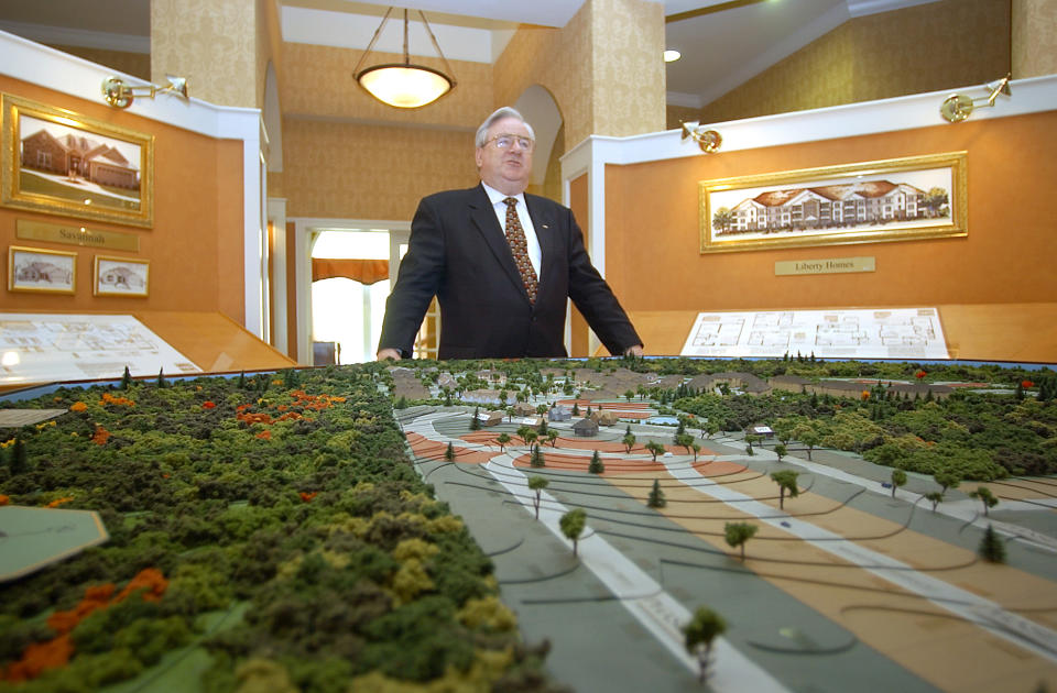 Rev. Jerry Falwell Sr. stands in front of a scale model of Liberty Village, a retirement center he planned outside Lynchburg, on May 30, 2002.