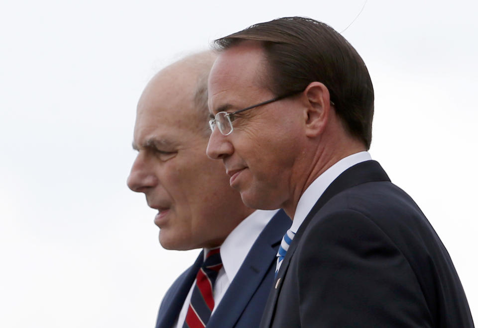 White House Chief of Staff John Kelly and Deputy Attorney General Rod Rosenstein step off Air Force One, Monday, Oct. 8, 2018, in Orlando, Fla. President Donald Trump said Monday he has no plans to fire Deputy Attorney General Rod Rosenstein, delivering a reprieve for the Justice Department official whose future has been the source of intense speculation for two weeks. (AP Photo/Alex Brandon)