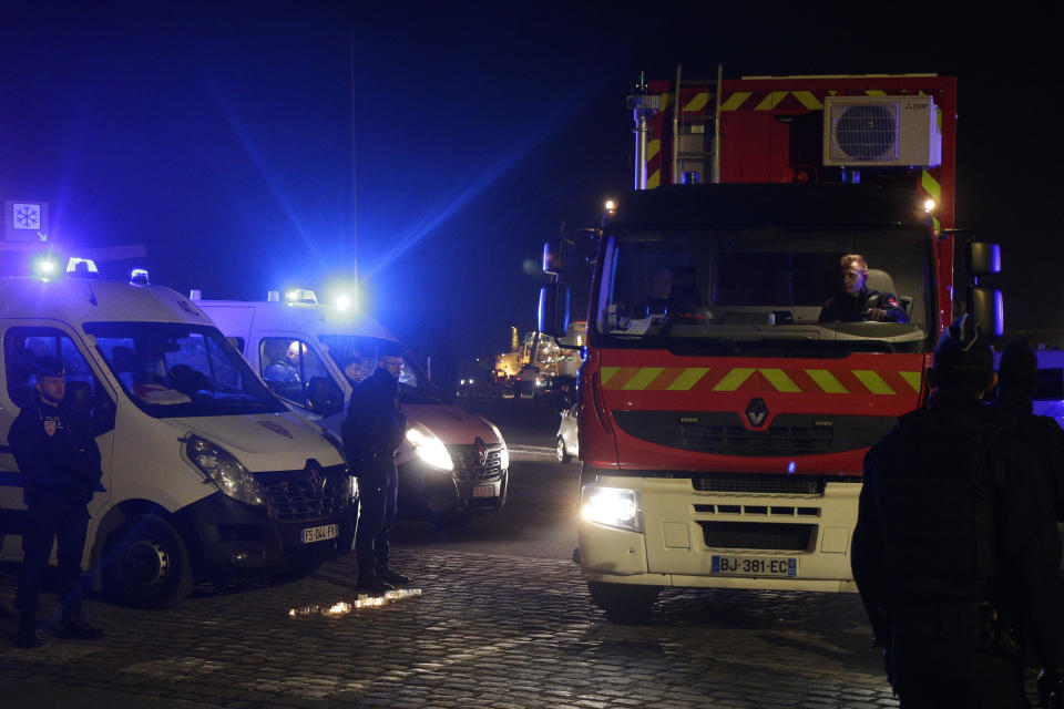 A rescue worker's truck leaves the port of Calais, in northern France, on Wednesday, November 24, 2021.  / Credit: Michel Spingler / AP