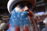 Adam Gazda of Savannah, Ga., shows off his beard painted in the colors of the American flag before a campaign rally for President Donald Trump, Friday, Feb. 28, 2020, in North Charleston, S.C. (AP Photo/Patrick Semansky)