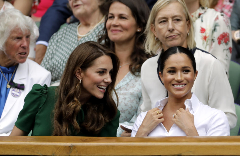 The Duchess of Cambridge and The Duchess of Sussex during the women's singles final on day twelve of the Wimbledon Championships at the All England Lawn Tennis and Croquet Club, Wimbledon.