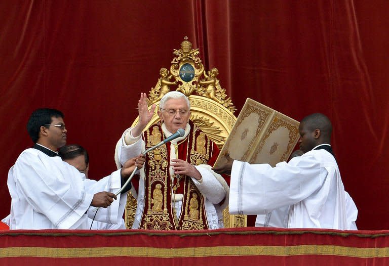 Pope Benedict XVI delivers his traditional Christmas "Urbi et Orbi" blessing from the balcony of St. Peter's Basilica at the Vatican on December 25, 2012. The Pope called for an "end to the bloodshed" in Syria and denounced the "savage" violence in Africa on Tuesday, even as Nigeria witnessed a Christmas attack on Christians